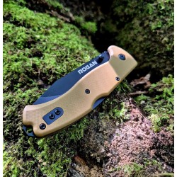 ROGAN Rogue Folding Pocket Knife - Gen 1 - Coyote Black closed on mossy log