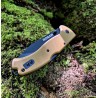 ROGAN Rogue Folding Pocket Knife - Gen 1 - Coyote Black closed on mossy log